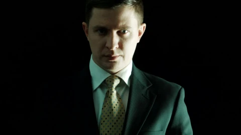 Stock Video Man In A Suit Putting Money On His Mouth Animated Wallpaper - Free Live Wallpaper