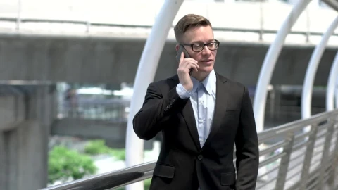 Stock Video Man In A Suit Talking On His Mobile Phone Animated Wallpaper - Free Live Wallpaper