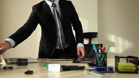 Stock Video Man In A Suit Organizing His Office Animated Wallpaper - Free Live Wallpaper