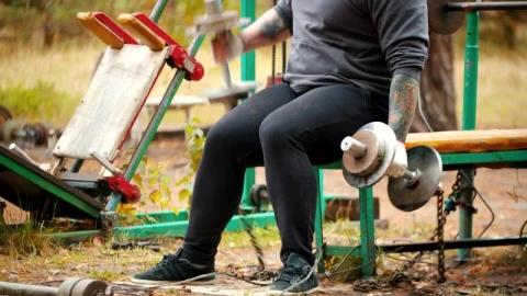 Stock Video Man In A Outdoors Gym With Dumbbells Animated Wallpaper - Free Live Wallpaper