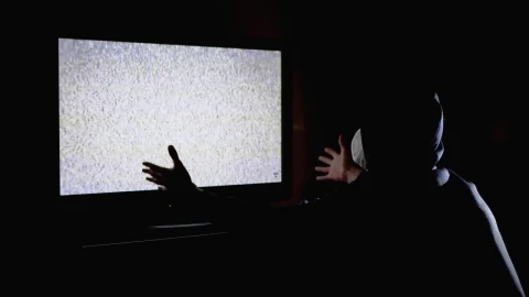 Stock Video Man In A Hoodie In Front Of A Tv With Animated Wallpaper - Free Live Wallpaper