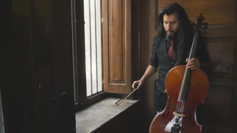 Stock Video Man Holding A Cello Animated Wallpaper - Free Live Wallpaper