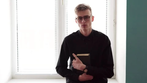 Stock Video Man Holding A Bible In Both Hands Animated Wallpaper - Free Live Wallpaper