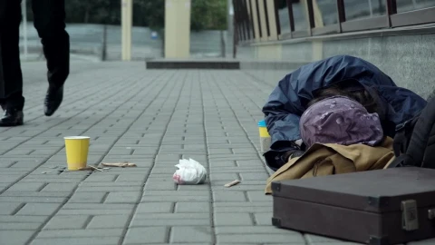 Stock Video Man Giving Money To Homeless Resting On The Street Animated Wallpaper - Free Live Wallpaper