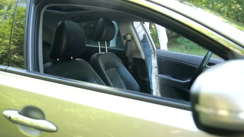Stock Video Man Getting Into A Car And Putting On A Seat Animated Wallpaper - Free Live Wallpaper