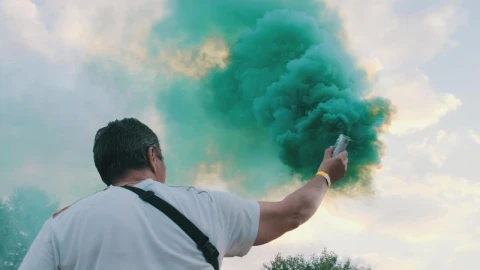 Stock Video Man From Behind Waving A Smoke Bomb Animated Wallpaper - Free Live Wallpaper