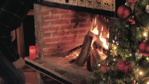 Stock Video Man Feeds The Fire From His Fireplace Animated Wallpaper - Free Live Wallpaper