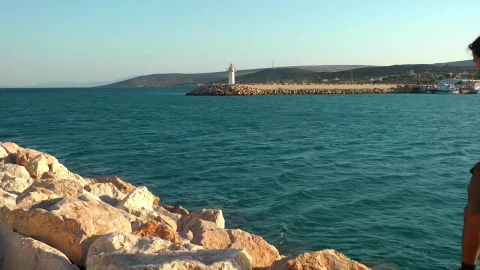 Stock Video Man Exploring A Rocky Hill By The Sea Animated Wallpaper - Free Live Wallpaper
