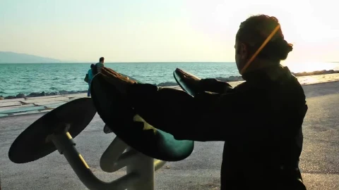 Stock Video Man Exercising In Front Of The Sea Animated Wallpaper - Free Live Wallpaper