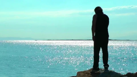 Stock Video Man Exercising On A Cliff By The Sea Animated Wallpaper - Free Live Wallpaper