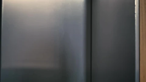 Stock Video Man Enters An Elevator Tapping His Wireless Earphones Animated Wallpaper - Free Live Wallpaper