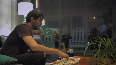 Stock Video Man Eats Watching Television On A Rainy Night Animated Wallpaper - Free Live Wallpaper