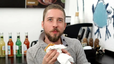 Stock Video Man Eating A Burger And Smiling Animated Wallpaper - Free Live Wallpaper