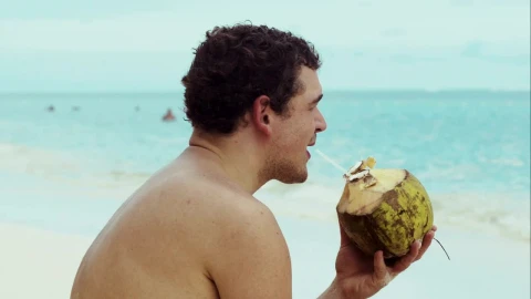Stock Video Man Drinking From A Coconut Animated Wallpaper - Free Live Wallpaper
