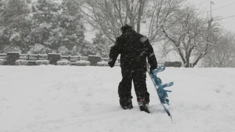 Stock Video Man Dragging His Snowboard Animated Wallpaper - Free Live Wallpaper