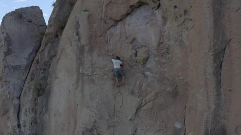 Stock Video Man Doing Mountaineering On A Large Rocky Mountain Animated Wallpaper - Free Live Wallpaper