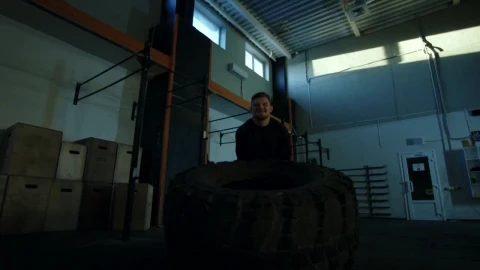 Stock Video Man Doing Crossfit Exercises With A Big Tire Animated Wallpaper - Free Live Wallpaper