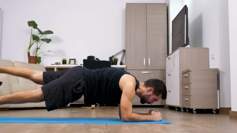 Stock Video Man Does Full Body Yoga Exercise In Living Room Animated Wallpaper - Free Live Wallpaper
