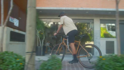 Stock Video Man Cycling Down A Street In A City Animated Wallpaper - Free Live Wallpaper