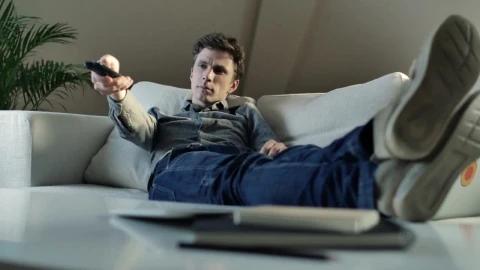 Stock Video Man Changing The Tv Channels From The Couch Animated Wallpaper - Free Live Wallpaper