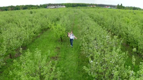 Stock Video Man Carrying His Bride Through A Field Animated Wallpaper - Free Live Wallpaper