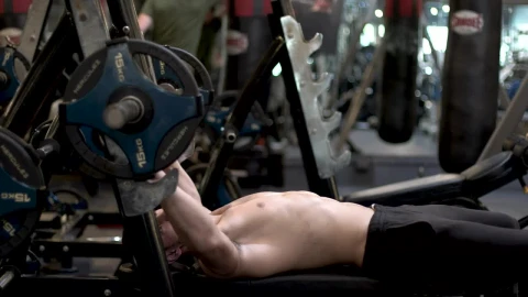 Stock Video Man At The Gym Exercising With A Dumbbell Animated Wallpaper - Free Live Wallpaper