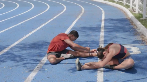 Stock Video Man And Woman Stretching Their Body Before Doing Sports Animated Wallpaper - Free Live Wallpaper