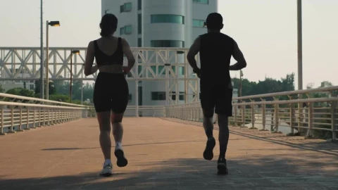 Stock Video Man And Woman Jogging Together On The Street Animated Wallpaper - Free Live Wallpaper