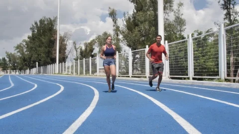 Stock Video Man And Woman Jogging On A Running Track Animated Wallpaper - Free Live Wallpaper