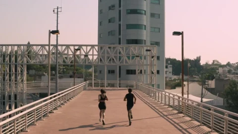 Stock Video Man And Woman Exercising On A Pedestrian Bridge Animated Wallpaper - Free Live Wallpaper