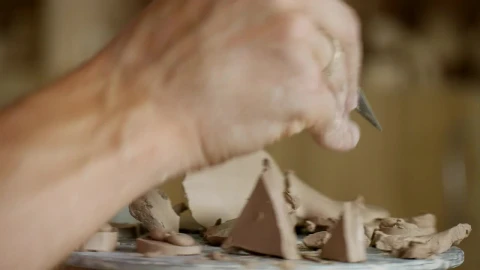 Stock Video Male Working On Clay With Cutting Tools Animated Wallpaper - Free Live Wallpaper