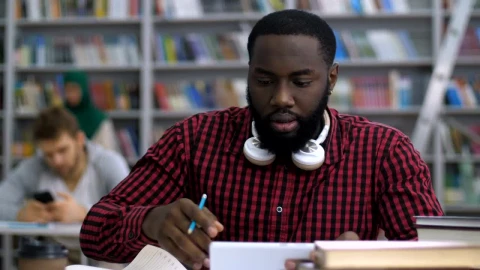 Stock Video Male Student Reading In The Library Animated Wallpaper - Free Live Wallpaper