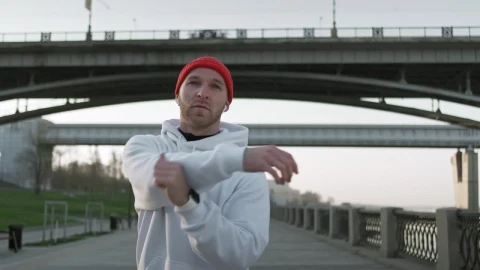 Stock Video Male Athlete Stretching His Arms Before Training Animated Wallpaper - Free Live Wallpaper