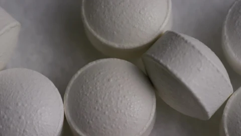 Stock Video Macro Shot Of White Compressed Pills Animated Wallpaper - Free Live Wallpaper