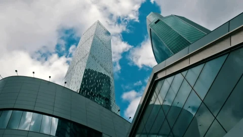 Stock Video Low View Of Office Buildings With Clouds In The Sky Animated Wallpaper - Free Live Wallpaper