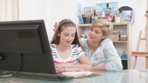 Stock Video Loving Mother Helps Girl With Home Education Animated Wallpaper - Free Live Wallpaper