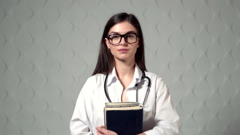 Stock Video Lovely Smiling Doctor Stands In Hospital Hallway Animated Wallpaper - Free Live Wallpaper