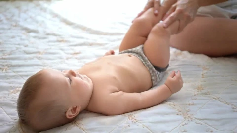 Stock Video Mother Exercising Her Babys Leg Animated Wallpaper - Free Live Wallpaper