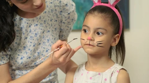 Stock Video Mother Draws Rabbit Whiskers To Her Daughte Animated Wallpaper - Free Live Wallpaper