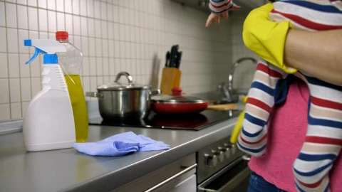 Stock Video Mother Cleaning A Kitchen While She Holds Her Bab Animated Wallpaper - Free Live Wallpaper