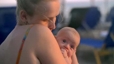 Stock Video Mother Carefully Holding Her Newborn Chil Animated Wallpaper - Free Live Wallpaper