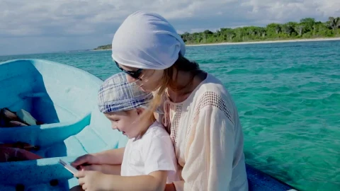 Stock Video Mother And Her Young Boy On A Small Boa Animated Wallpaper - Free Live Wallpaper
