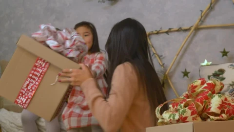 Stock Video Mother And Daughters Opening Presents On Christmas Da Animated Wallpaper - Free Live Wallpaper