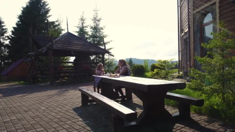 Stock Video Mother And Daughter At Lunch On An Outdoor Benc Animated Wallpaper - Free Live Wallpaper