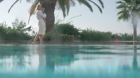 Stock Video Mother And Baby Walking By A Poo Animated Wallpaper - Free Live Wallpaper