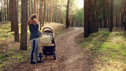 Stock Video Mom Talking On The Phone In The Wood Animated Wallpaper - Free Live Wallpaper