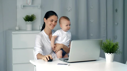 Stock Video Mom On Her Computer While Taking Care Of Her So Animated Wallpaper - Free Live Wallpaper