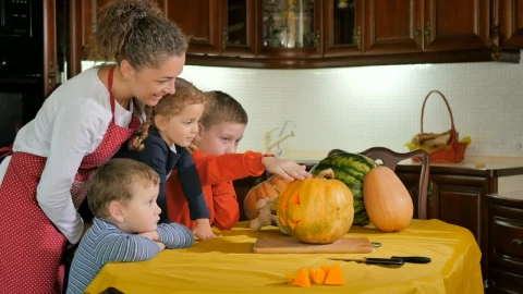 Stock Video Mom Helps Kids Prepare Jack O Lantern Pumpkin In Kitche Animated Wallpaper - Free Live Wallpaper