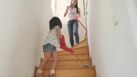 Stock Video Mom And Daughter Sweeping The Stairs At Hom Animated Wallpaper - Free Live Wallpaper