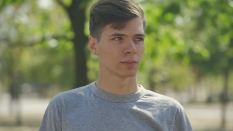 Stock Video Millennial Man Smiles At Camera In Outdoor Portrai Animated Wallpaper - Free Live Wallpaper